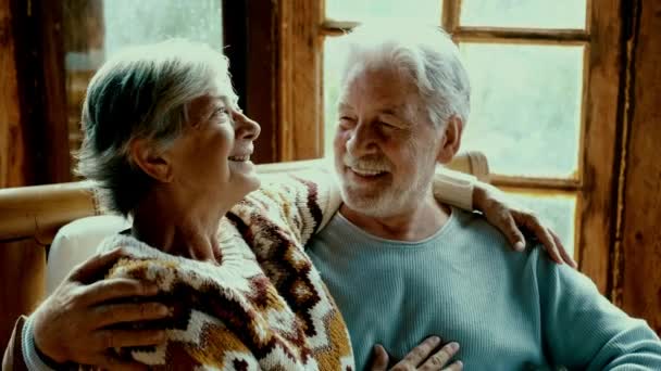 Happy Enjoyed Senior Caucasian Couple Smile Hug Each Other Sitting — Wideo stockowe