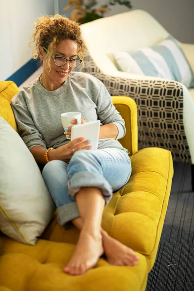 Adult Woman Glasses Sitting Cup Tea Tablet Couch — 스톡 사진