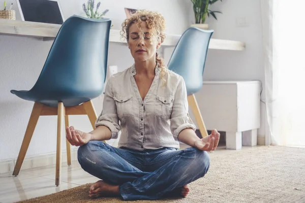 Woman Sitting Asana Meditating Home – stockfoto