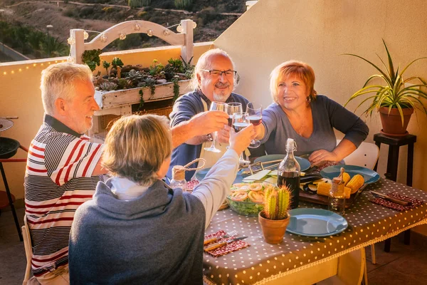 Mature Adult Friends Enjoy Clinking Wine Table Happy Retired People —  Fotos de Stock