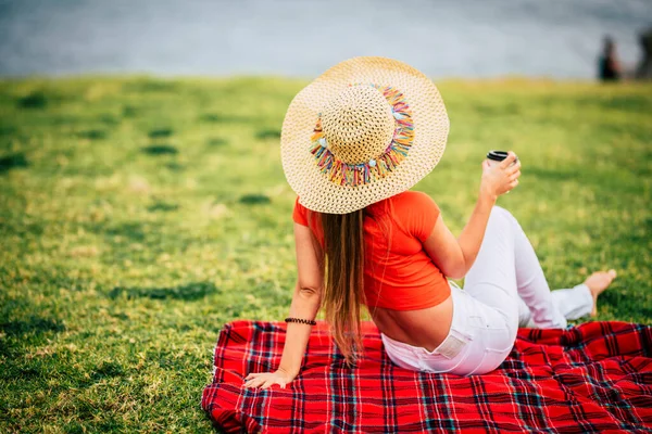 Back View Trendy Female Tourist Relaxing Sitting Red Cover Meadow — 스톡 사진
