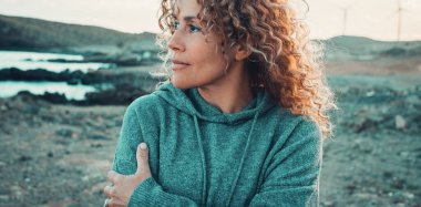 Banner header image of attractive woman portrait in outdoor leisure activity alone. Lady enjoying freedom and scenic destination. Travel people lifestyle. Female with Copy space and scenic background