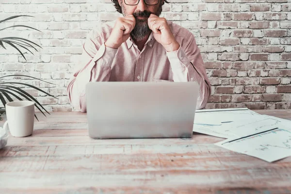 Front View Man Working Desk Laptop Paper Charts Concept Business — Stockfoto