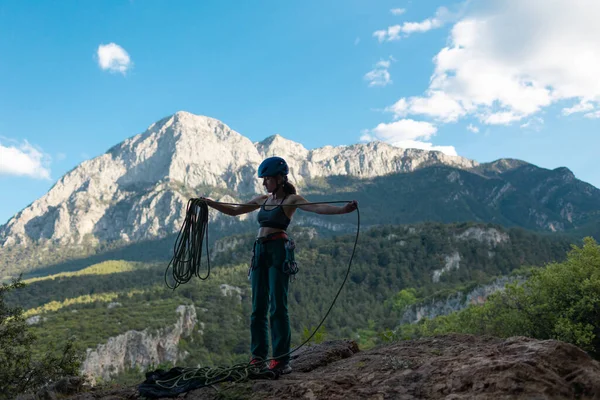 Woman Helmet Coils Rope Background Large Mountain Rock Climber Prepares — стоковое фото