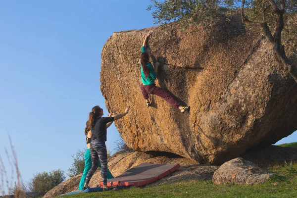 Strong Girl Climbs Large Boulder Bouldering Natural Terrain Friends Climbing - Stock-foto