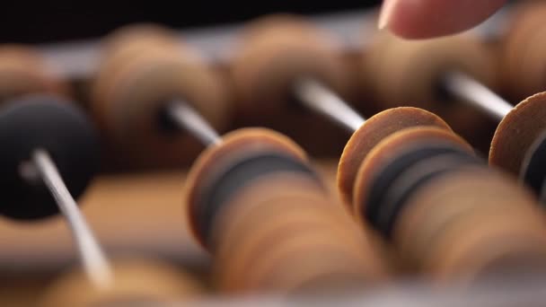 Male finger counting using old wooden abacus macro — Stock Video