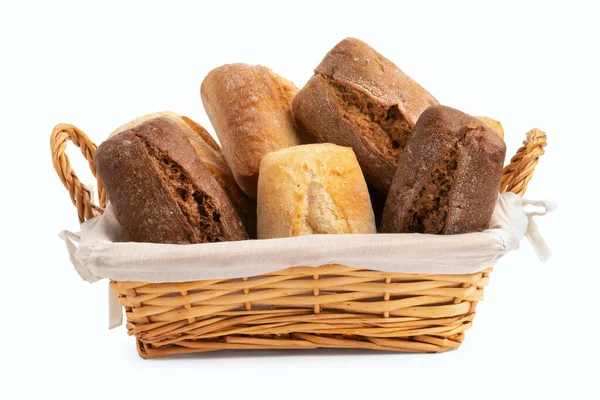 Fresh wheat and rye buns in a wicker basket isolated on white — Stock Photo, Image