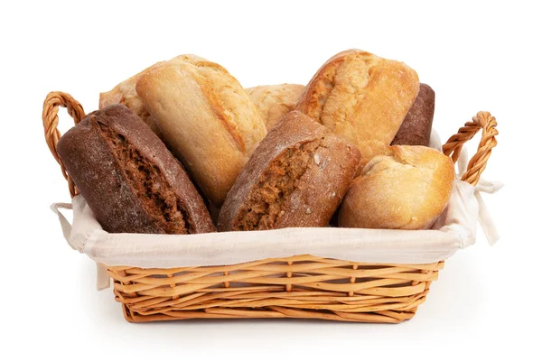 Fresh wheat and rye buns in a wicker basket isolated on white — Stock Photo, Image