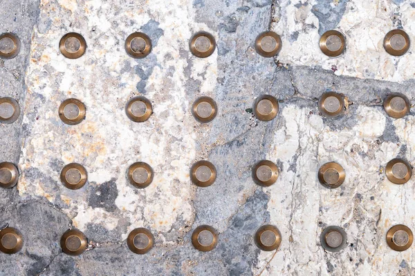 Background with Tactile paving for blind people on the ancient stone pavement of an Old Jaffa street in Israel