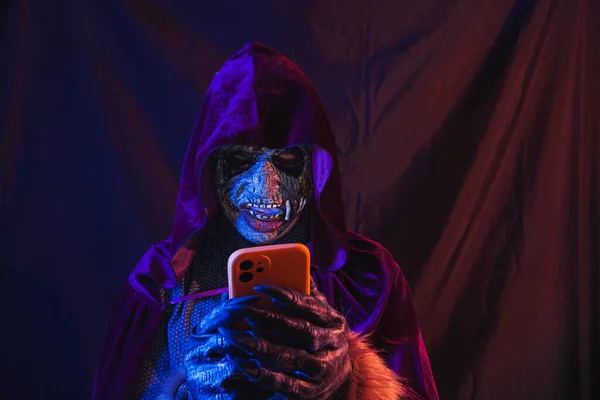 Portrait Zombie Dressed Shirt Hooded Cape Using His Cell Phone — Zdjęcie stockowe