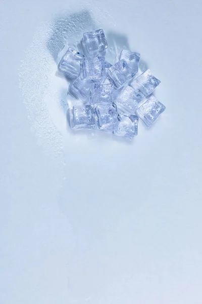 Overhead Shot Pile Ice Cubes White Surface Which Water Resulting — Stockfoto