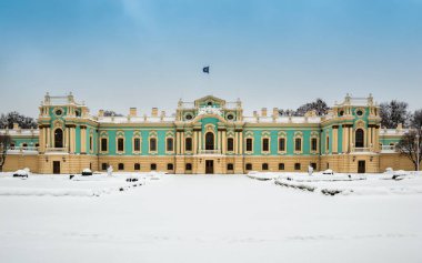 Mariyinsky Palace on winter day in Kyiv, Ukraine. Front facade of official ceremonial residence of the President of Ukraine. Beautiful baroque building in Mariinsky park on Dnipro river bank