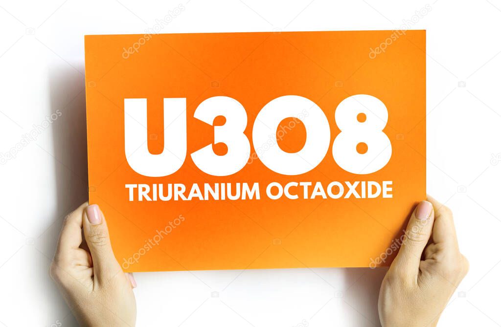 U3O8 - triuranium octaoxide acronym on card, concept background