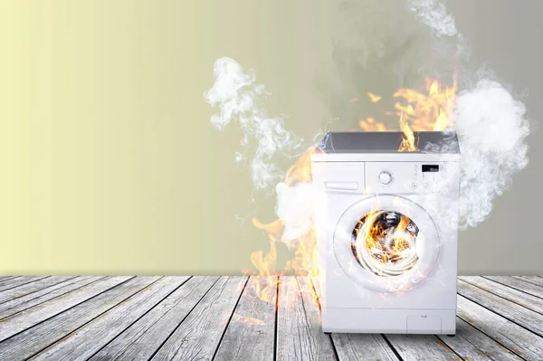 Broken white Washing Machine With Smoke And Fire