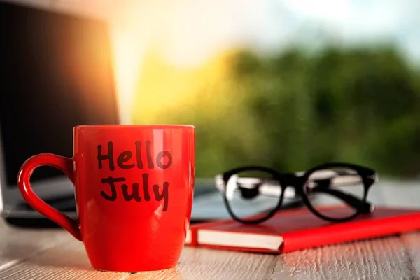 Cup Coffee Hello July Laptop Red Book Wooden Table — Foto Stock