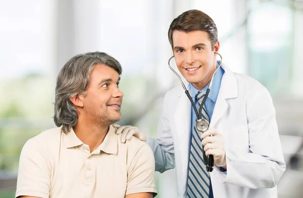 Young Doctor Doing Medical Exam Mature Man Patient — Stockfoto