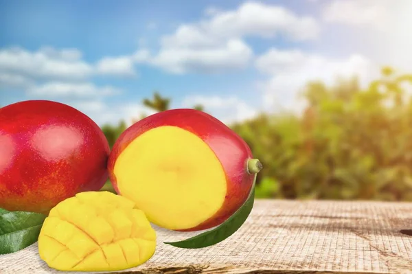 ripe red mangos on a natural background