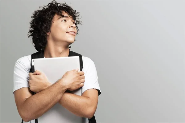 Joven Guapo Sosteniendo Una Computadora Imagen De Stock