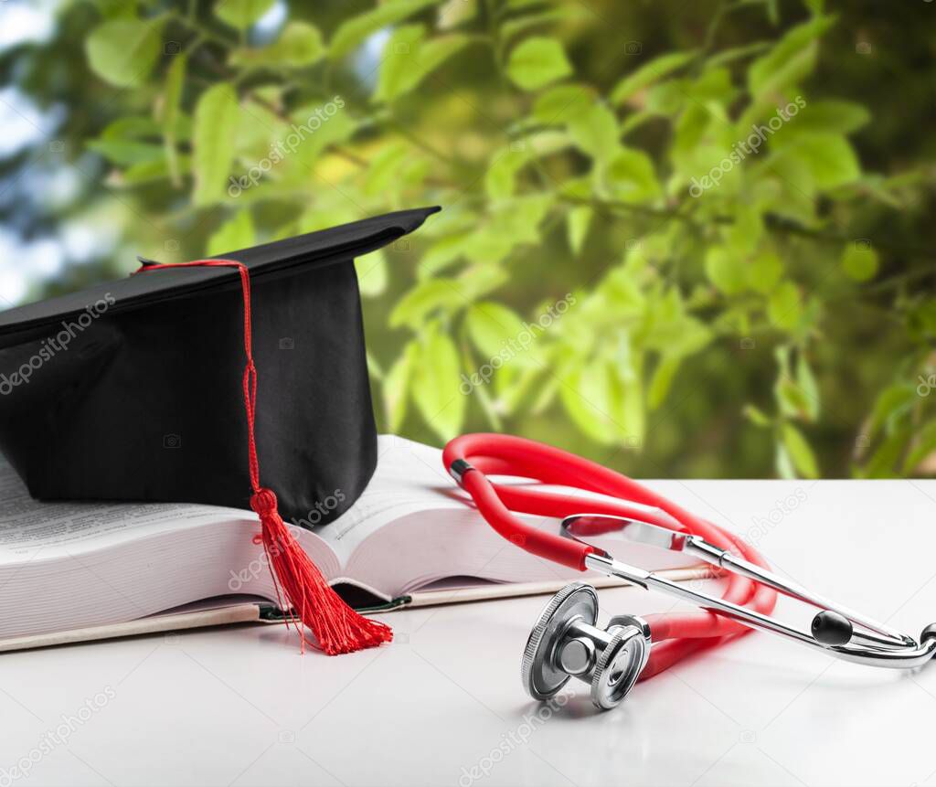 Stethoscope with graduation hat and diploma