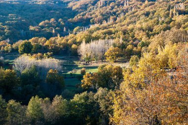 Autumn landscape of northern Extremadura at sunset in the Ambroz Valley clipart