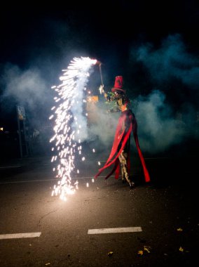 Magical autumn parade Hervas fireworks man with stilts 2 clipart