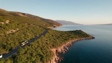 Aerial View Landscape Rocky Coast of Croatia with Curvy Mountain Road at Sunset
