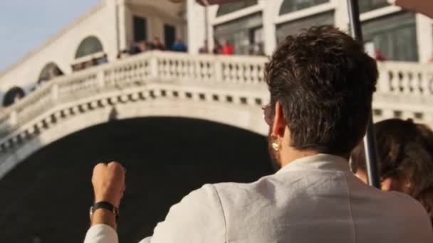 Rich Man with Golden Earring in Ear Resting in Restaurant, Rialto Bridge, Venice — Stock Video