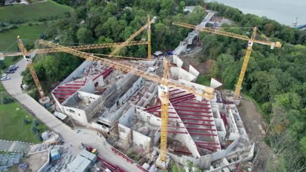 Aerial View Construction of a New building with High Tower Cranes in Green Area — Stock Video