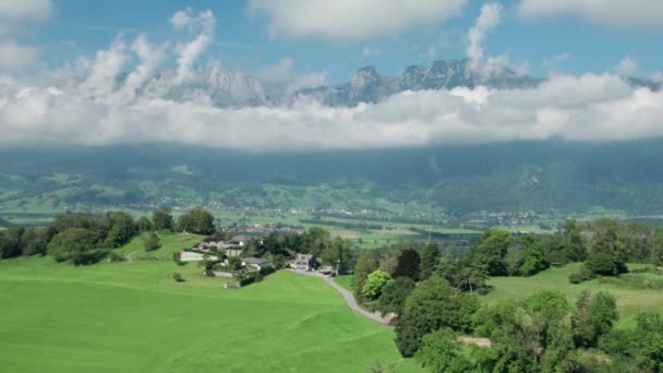 Aerial view of Liechtenstein with Houses on Green Fields in Alps Mountain Valley — Stock Video