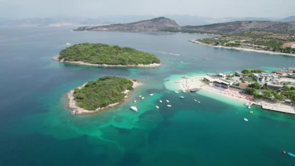 Air, Azure Beach with Empty Sun Loungers and Boats, Balkan Sea Coast, Albania — Stock video