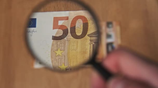 Fifty Euro Under Magnifying Glass — Stock Video