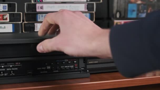 Insert VHS Cassette into VCR and Push Play Button — стокове відео