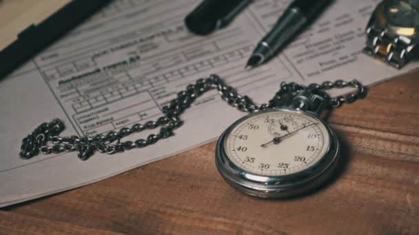 ( 영어 ) Antique Stopwatch Lies on Wooden Desk with Old Documents and Counts Seconds — 비디오