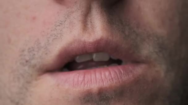 Man Erotically Licks His Lips With His Tongue, Close-Up — Stock Video