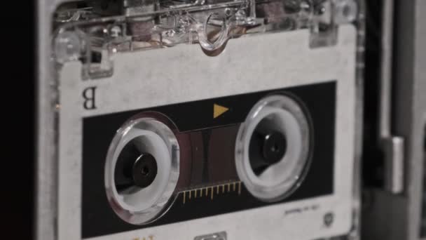 Vintage Audio Tape with a Blank Label Spinning in Cassette Recorder, közelkép — Stock videók