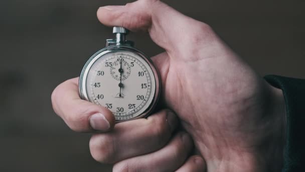 Stopwatch in Male Hand Counts Down Seconds — Stock Video