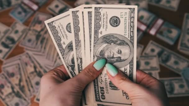 Dollars in Woman Hands on Background of Table with Money — Stock Video