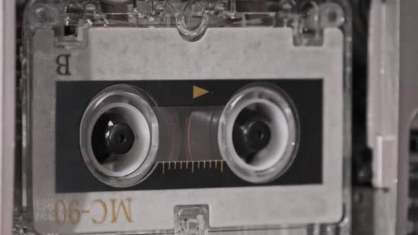 Vintage Audio Tape with a Blank Label Spinning in Cassette Recorder, közelkép — Stock videók