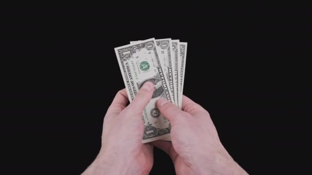 Τα αρσενικά χέρια δείχνουν αρκετούς λογαριασμούς ενός δολαρίου με το κανάλι Alpha — Αρχείο Βίντεο