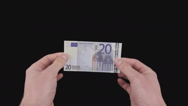 As mãos masculinas mostram uma nota de 20 euros com canal Alpha — Vídeo de Stock