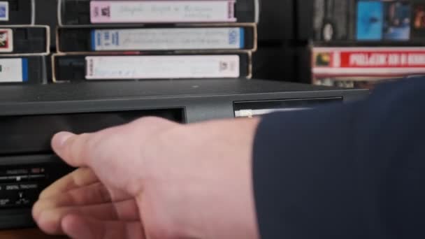 Insert VHS Cassette into VCR and Push Play Button — Stock Video