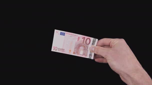 Mano masculina muestra un billete de 10 euros con canal alfa — Vídeos de Stock