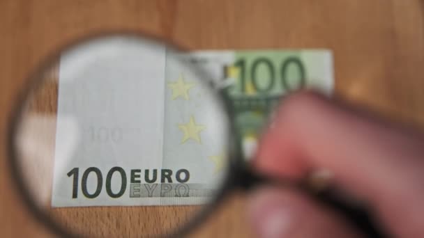 One Hundred Euro Under Magnifying Glass — Stock Video