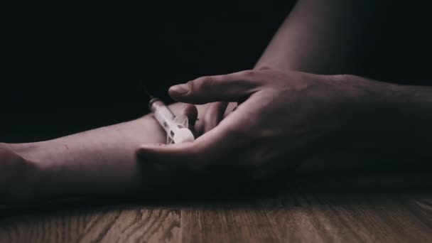 Addict Hand with Syringe Falls to Floor Just Pricked Heroin Drugs, Slow Motion — Stock Video