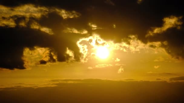 Dramatic Sunset with Sun Rays in Sky Through Orange Layered Clouds, Timelapse — стокове відео