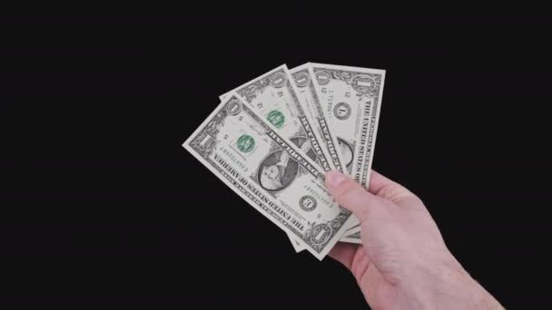 Mãos masculinas mostram várias contas de um dólar com canal alfa — Vídeo de Stock