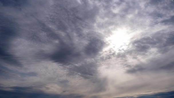Layered Clouds Move in Blue Sky Under Bright Sun, Fluffy Cloudscape Timelapse — Vídeo de stock