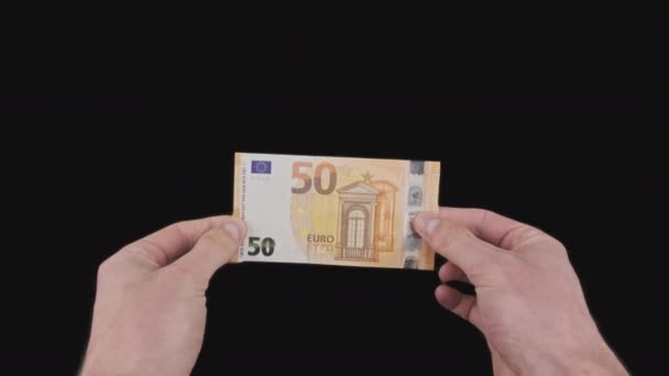 Male Hands Show a Banknote of 50 Euros with Alpha Channel — стокове відео