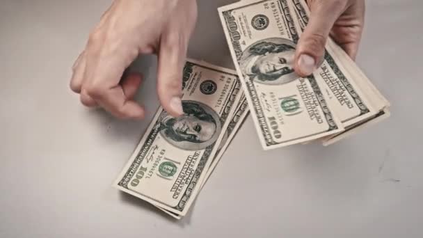 Male Hands Counting Old Hundred Dollar Banknotes on a White Table — Vídeos de Stock