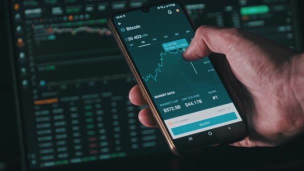 Investor Checking Bitcoin Smartphone Screen Cryptocurrency Price Index Mobile Phone — Vídeo de Stock
